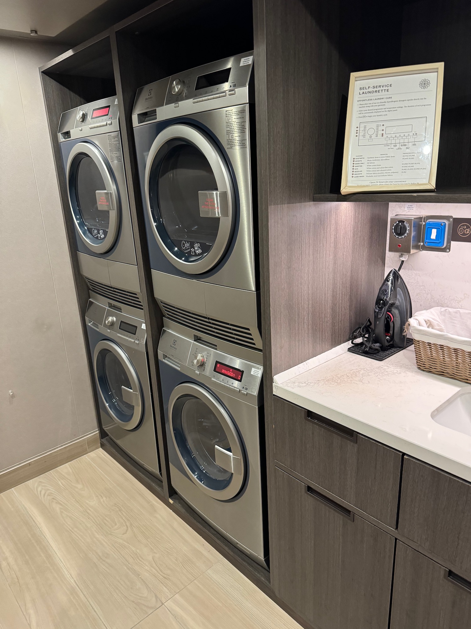 a laundry room with washers and dryers