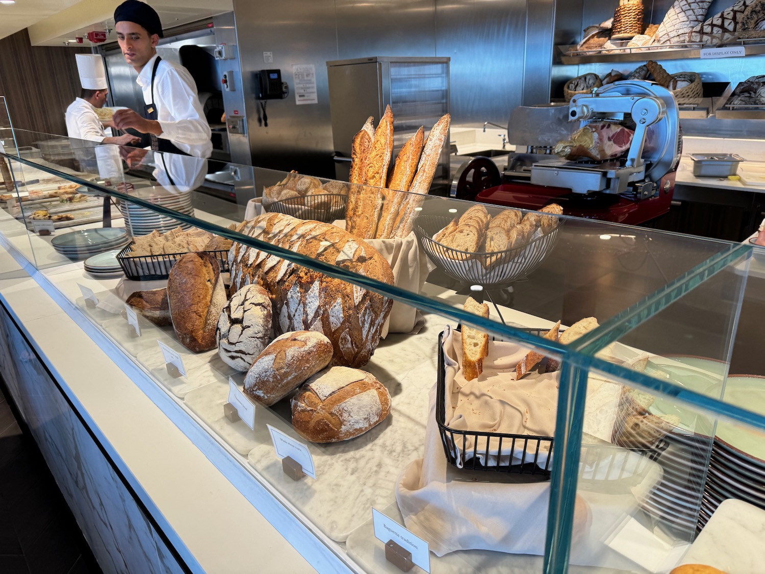 a display case with bread and other food