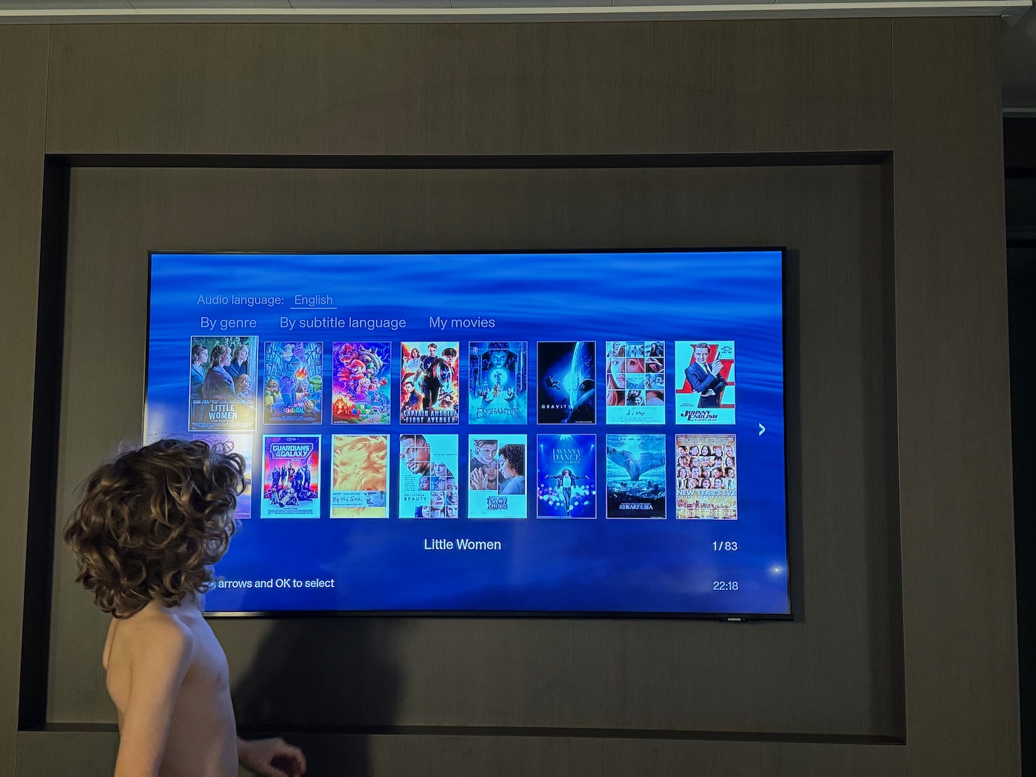 a boy looking at a television screen