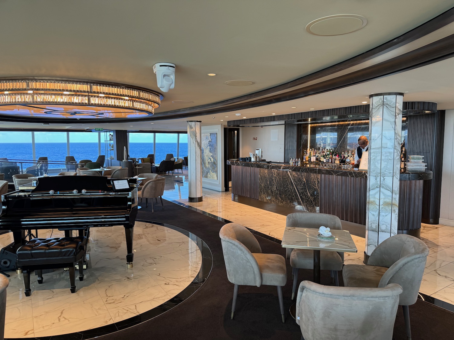 a room with a piano and a bar