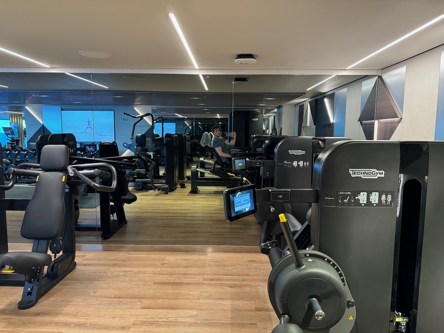 a man taking a selfie in a gym