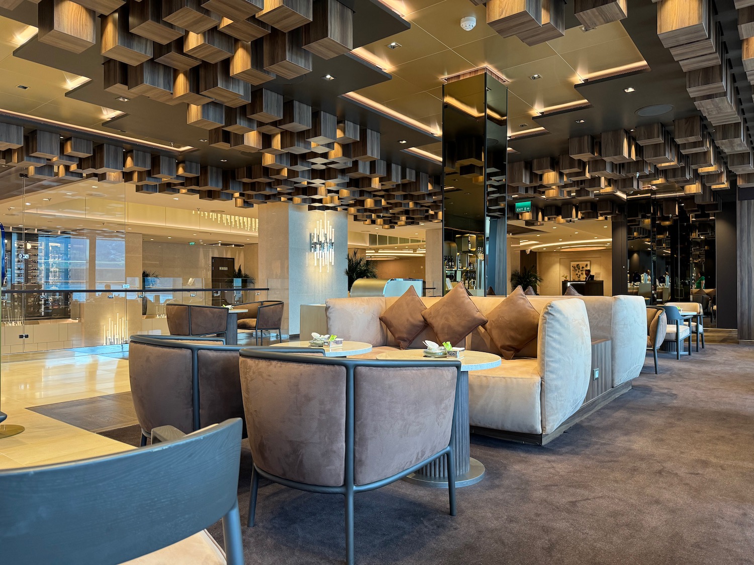 a room with a large ceiling and a large table and chairs