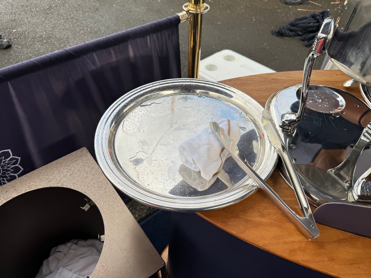 a silver tray with a towel on it