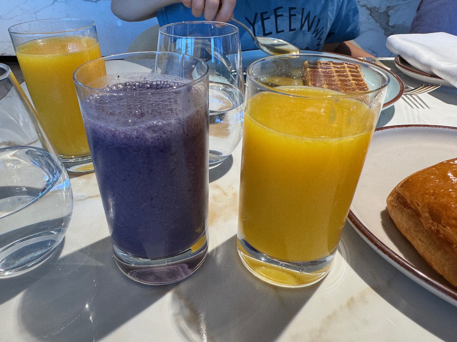 a group of glasses of juice