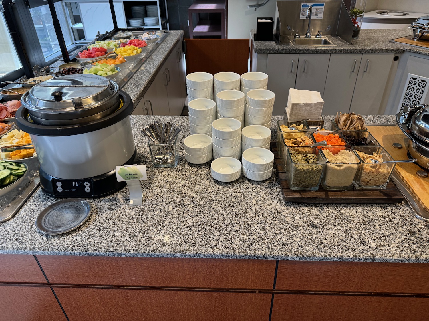 a buffet table with food and a crockery