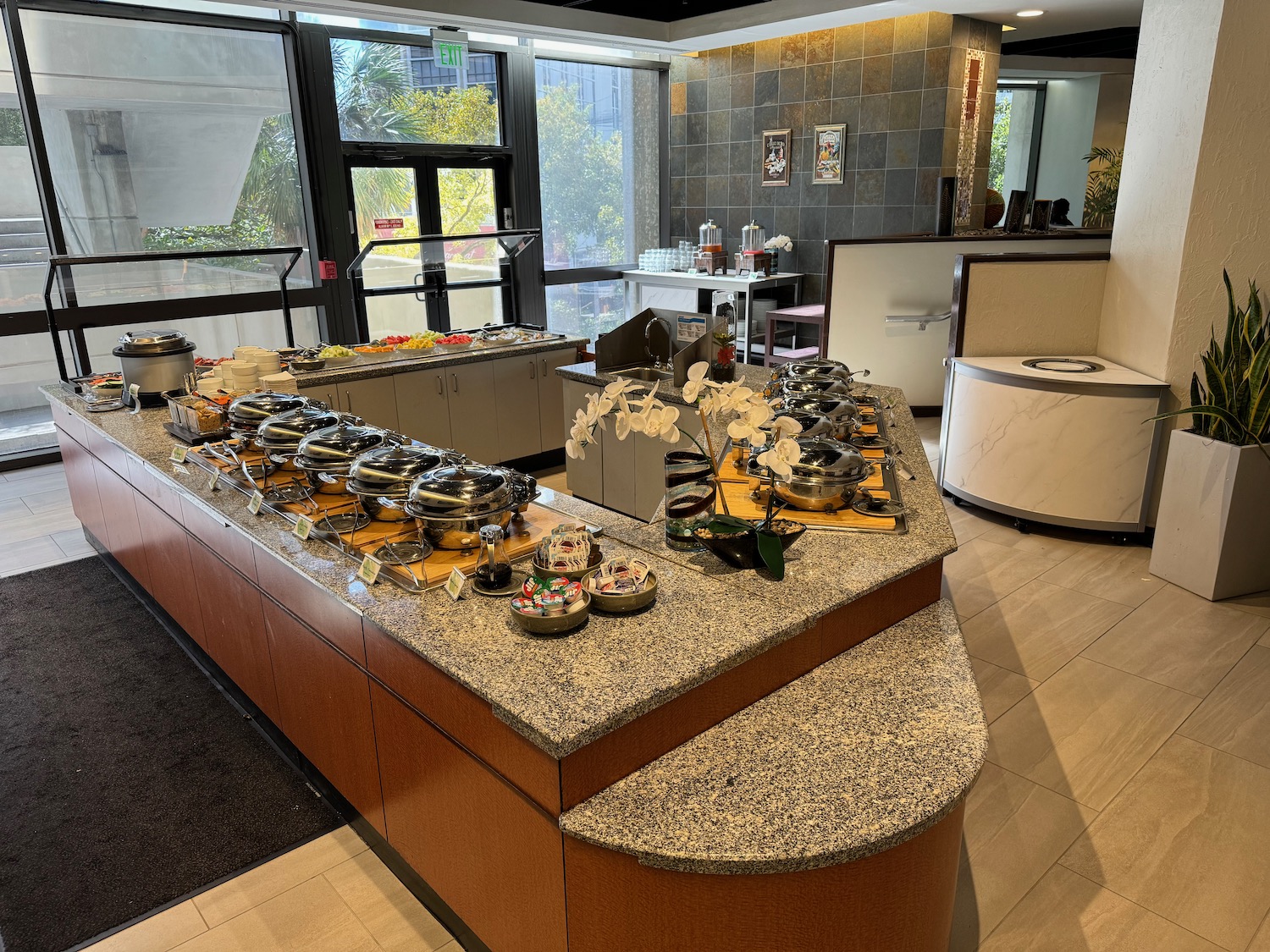 a kitchen with a large counter with food on it