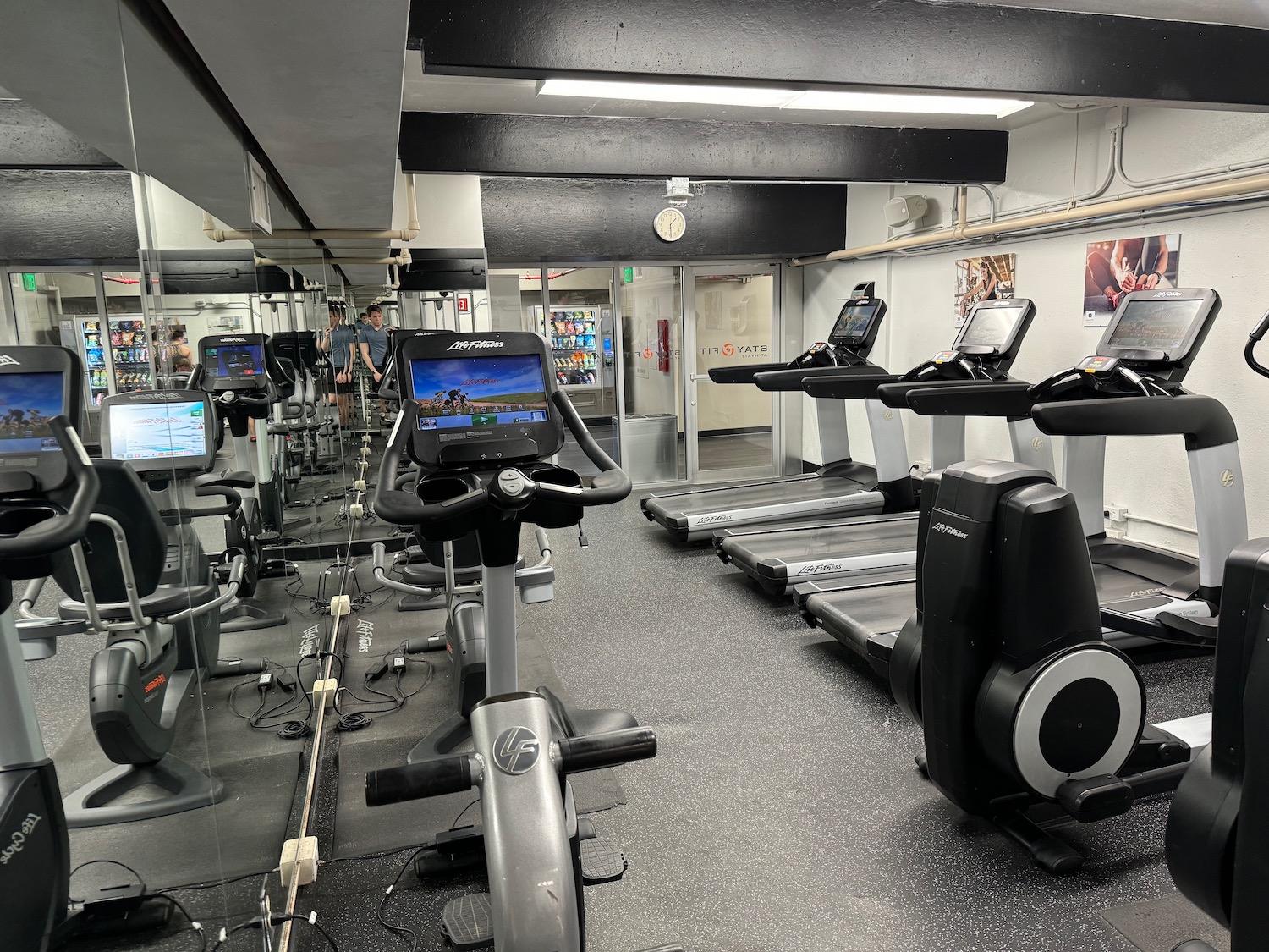 a room with treadmills and exercise machines