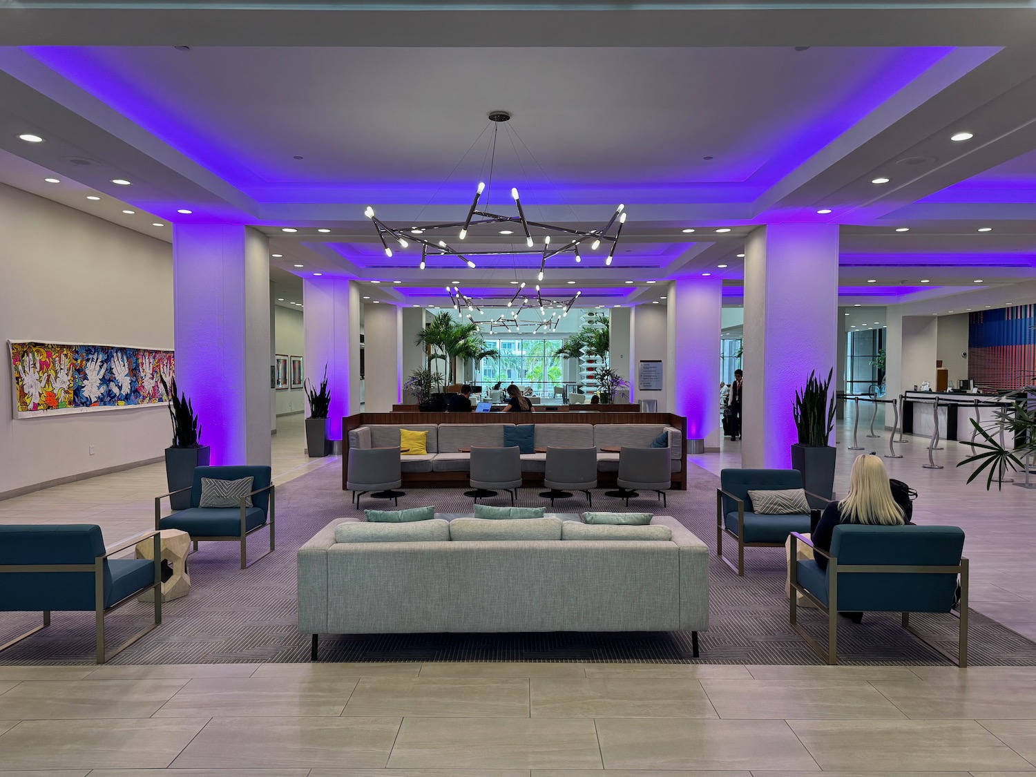 a room with purple lights and a couch