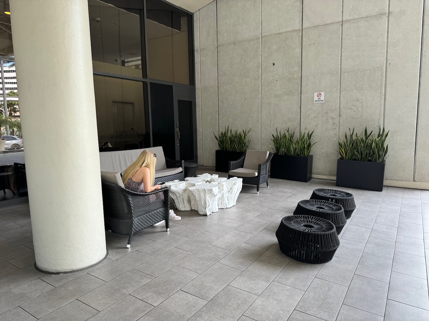 a woman sitting on a chair in a building