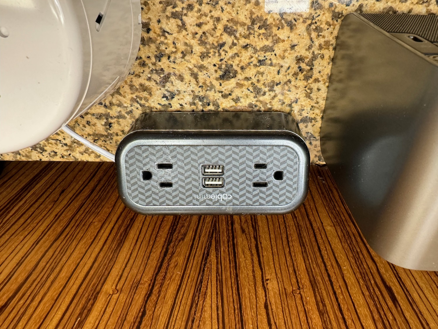 a power outlet on a marble surface