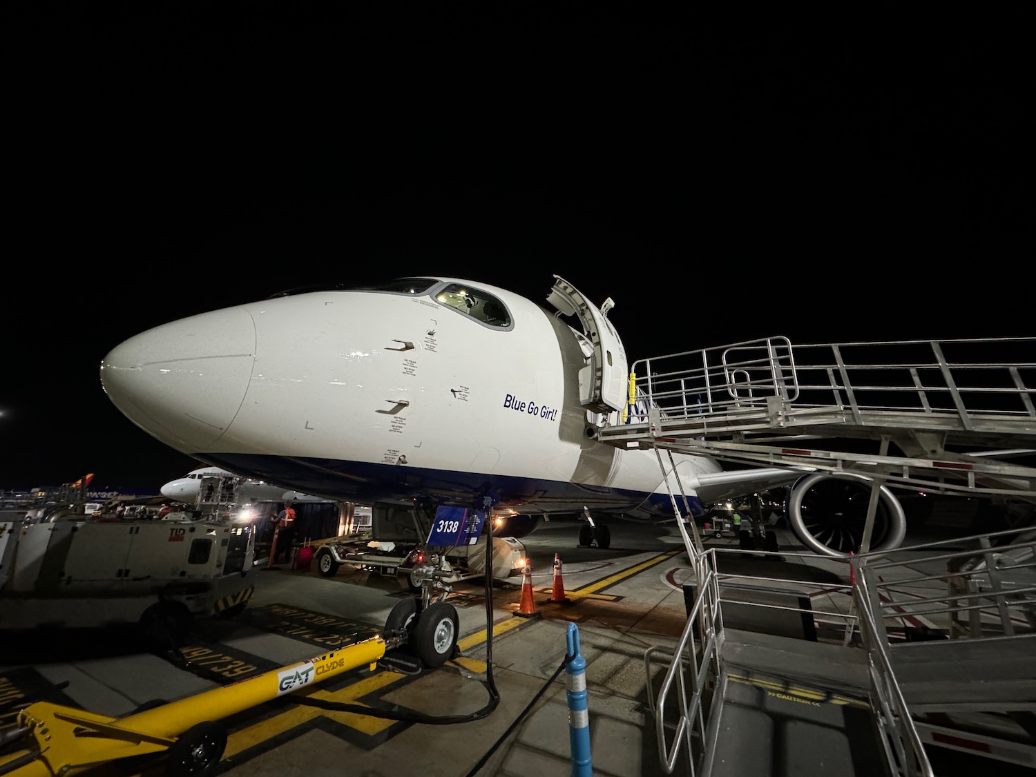 a plane at night with a ladder