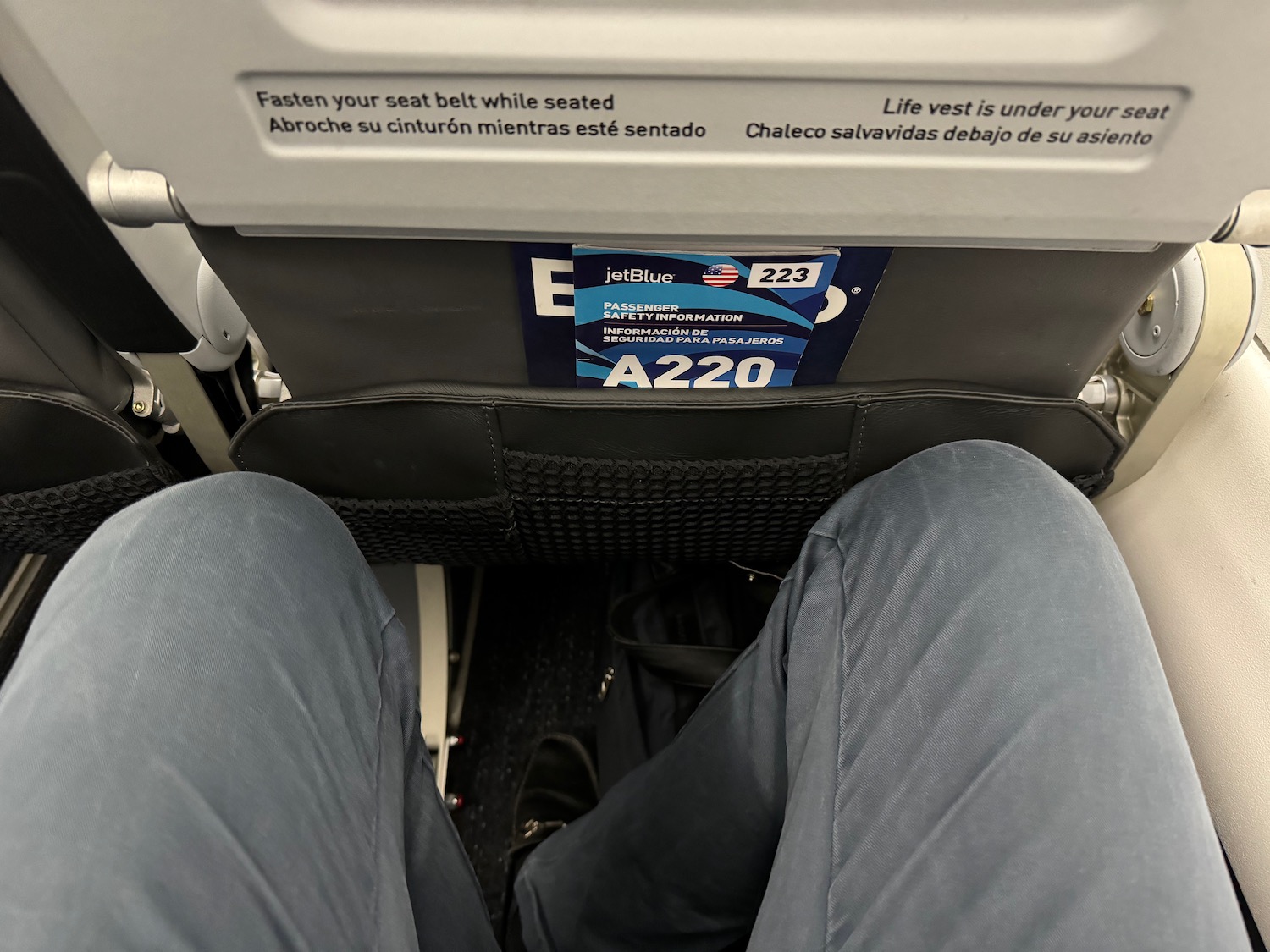 a person's legs in a seat