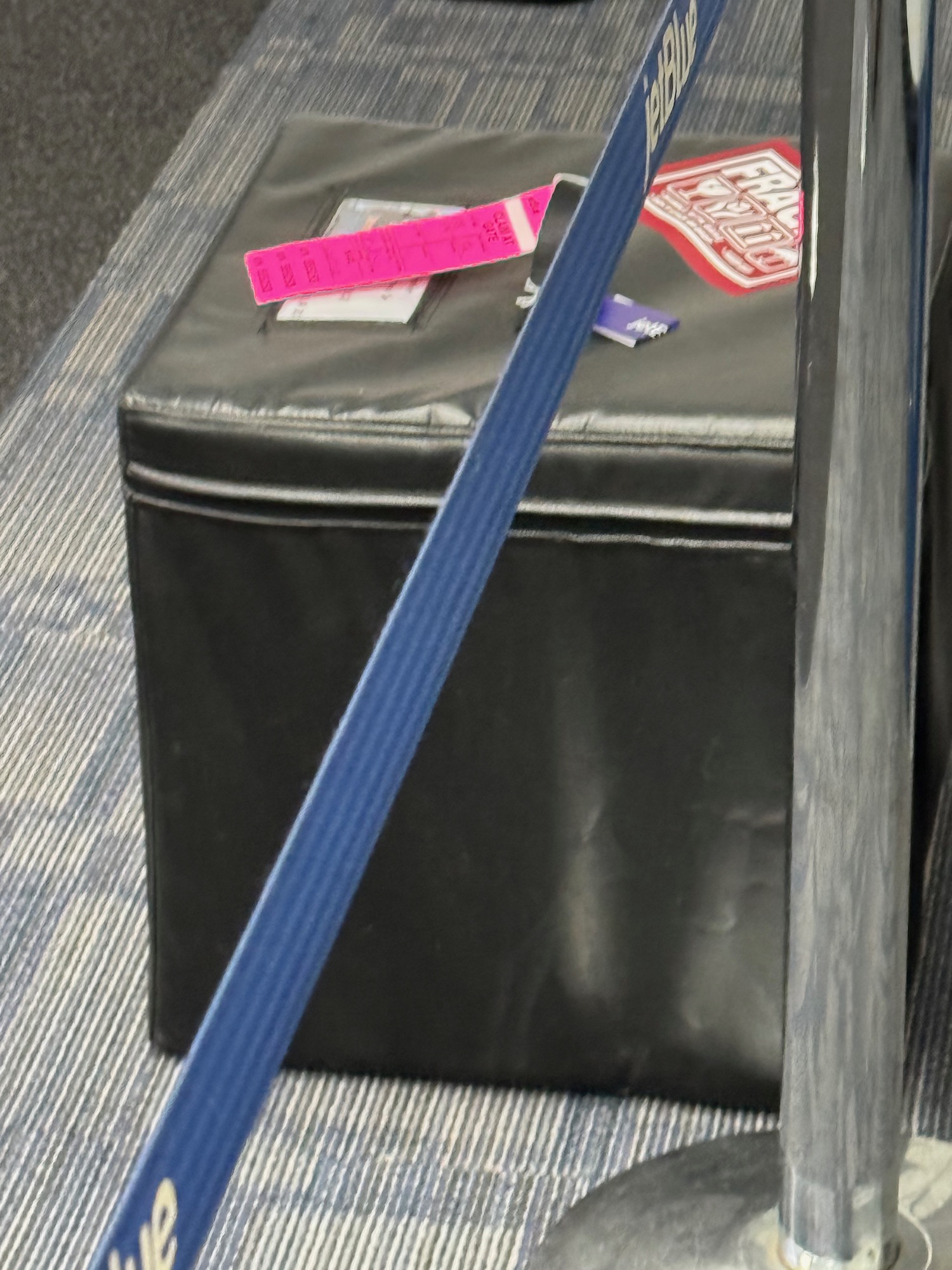 a blue belt on a black box