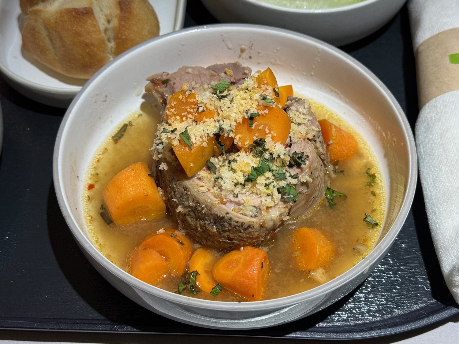 a bowl of soup with meat and vegetables