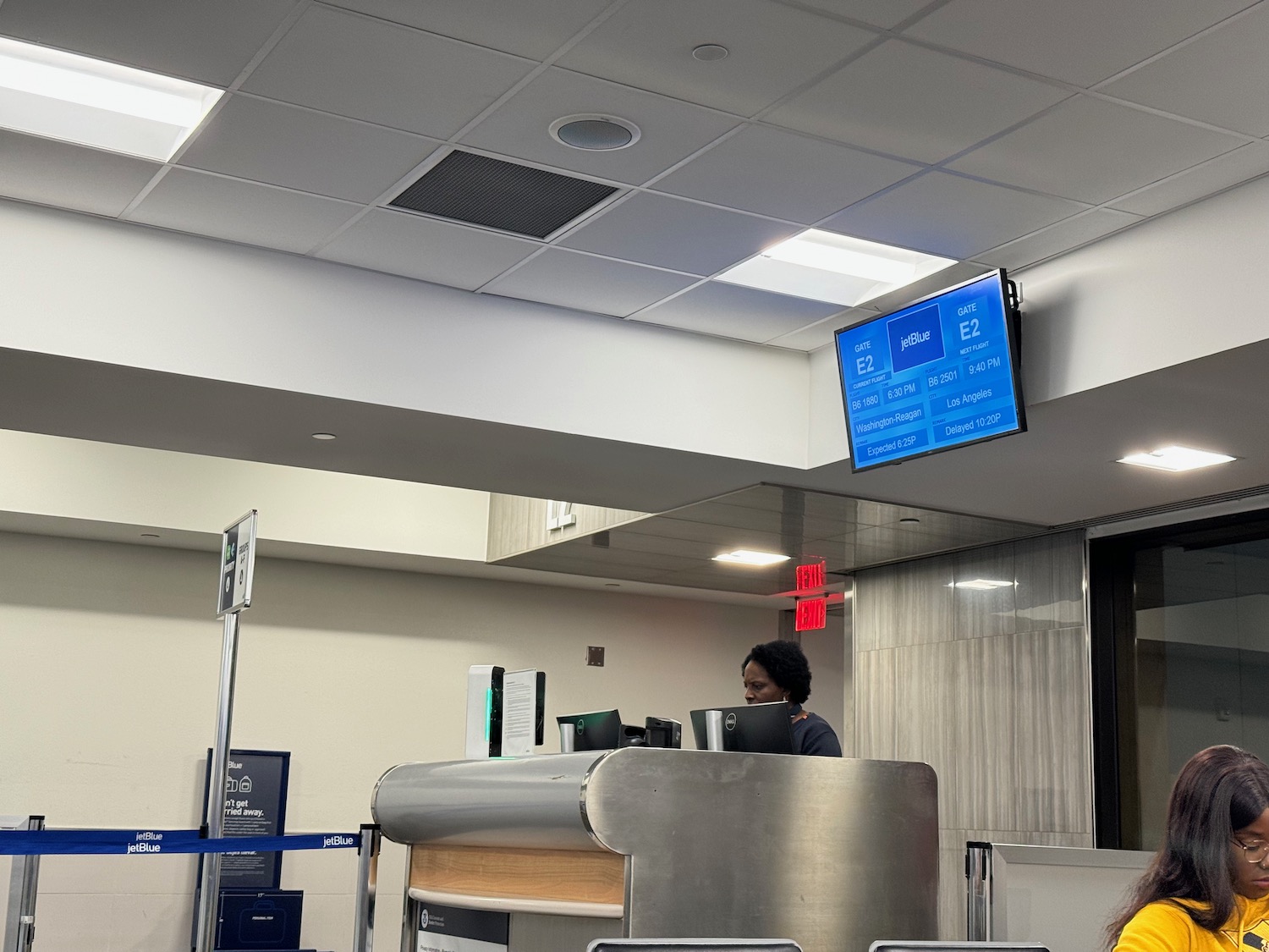 a person at a desk in an airport