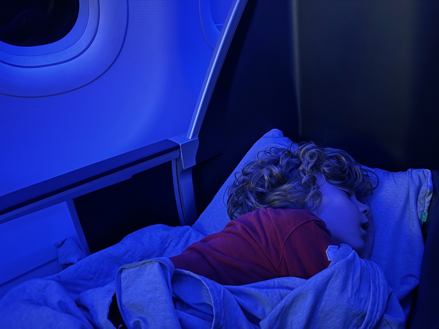 a child sleeping in a plane