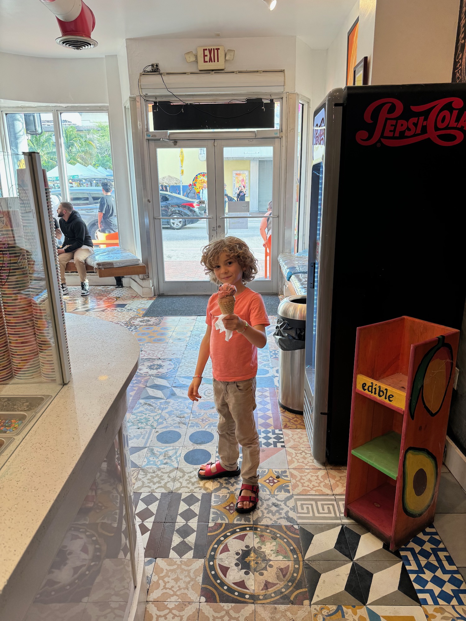 a child holding an ice cream cone