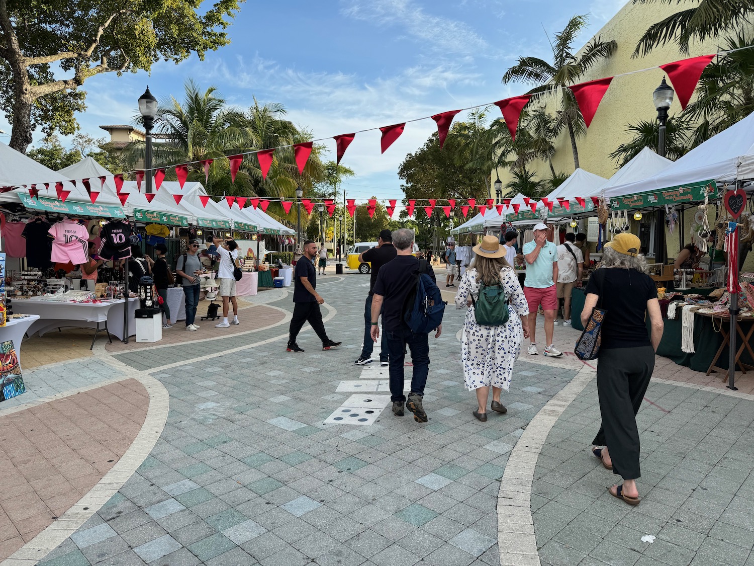 people walking around a street market