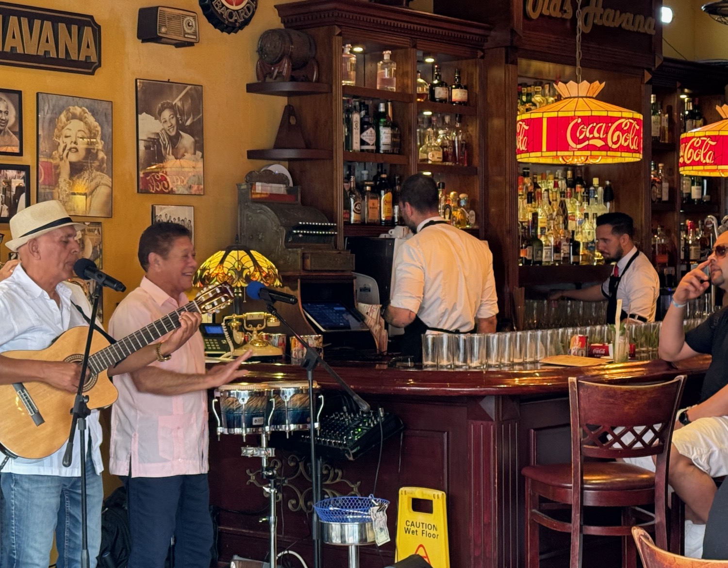 a group of men playing instruments in a bar