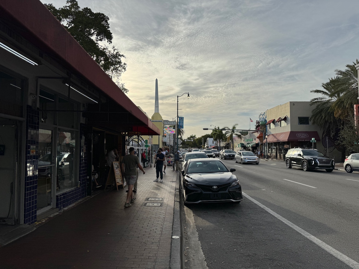 a street with cars and people on it