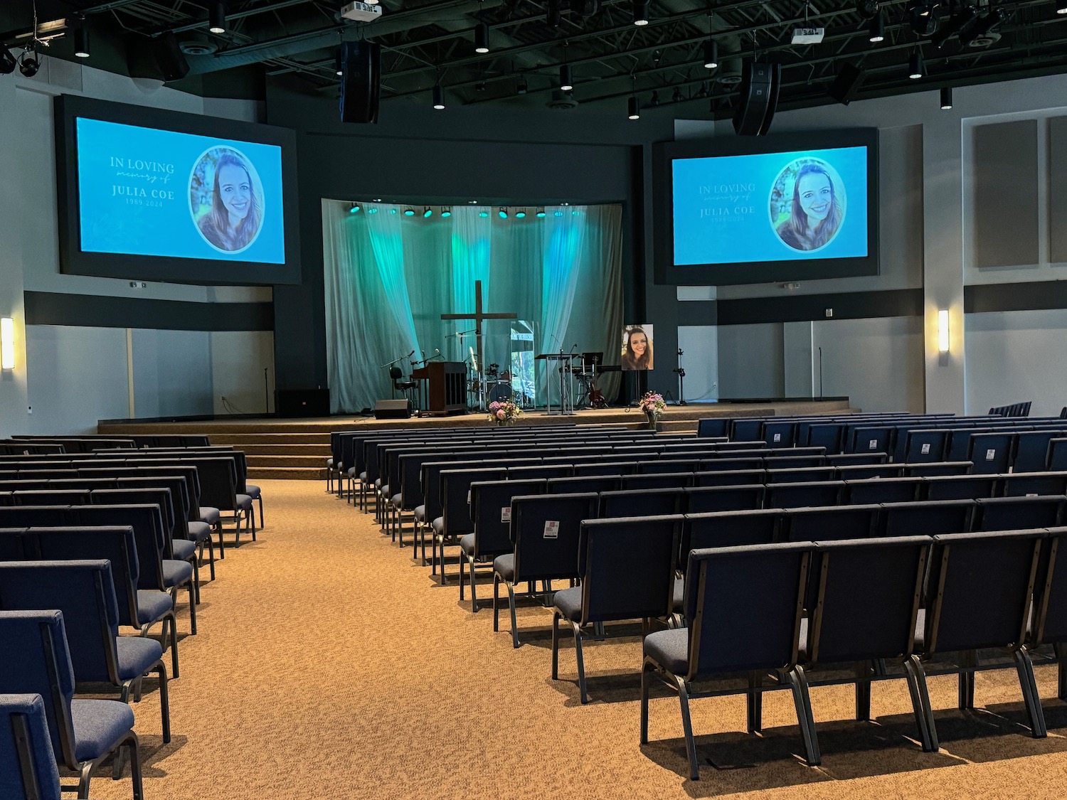 a large room with chairs and a stage