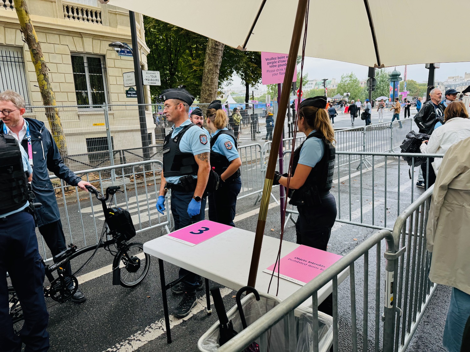 a group of people in uniform standing next to a table