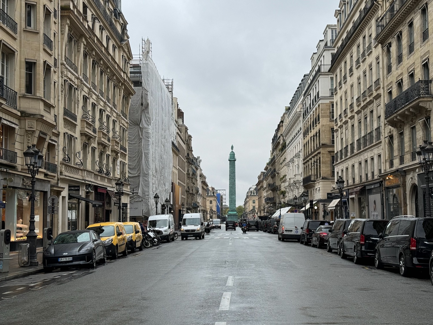 a street with cars and buildings