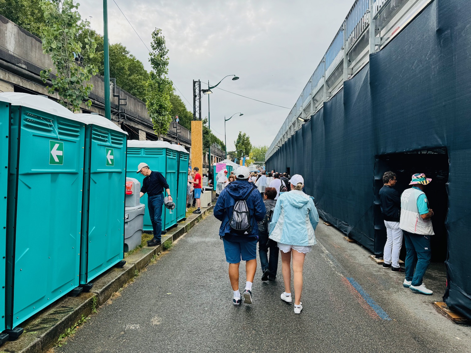 a group of people walking down a street