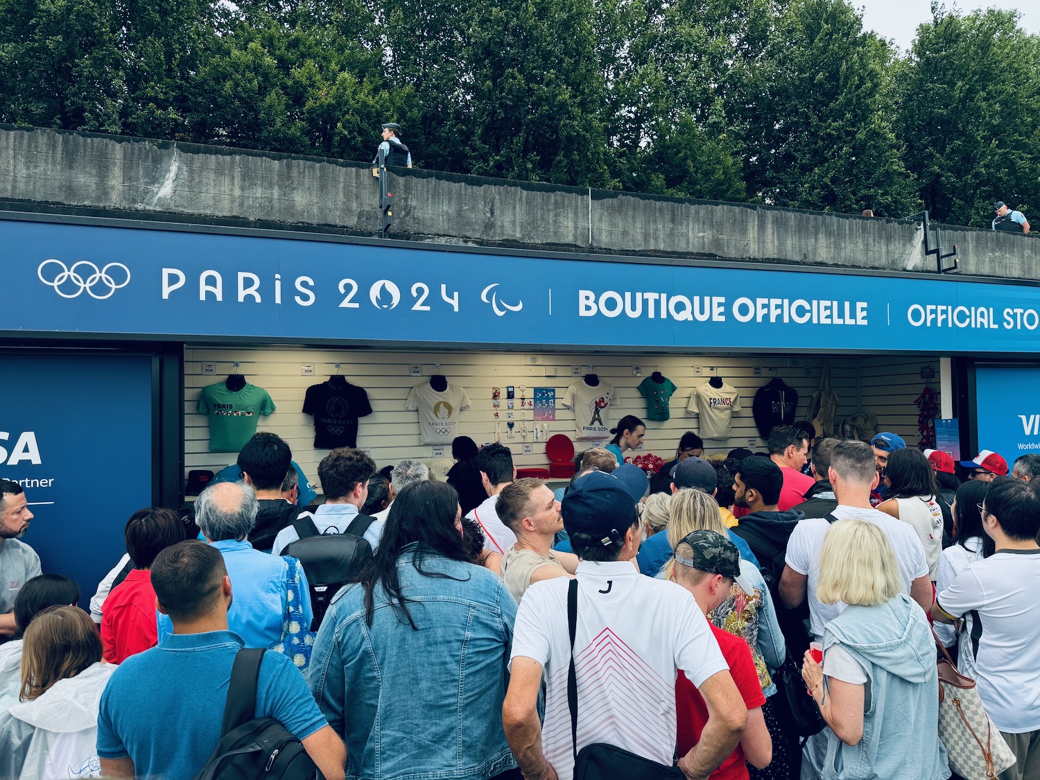 a group of people standing in front of a store