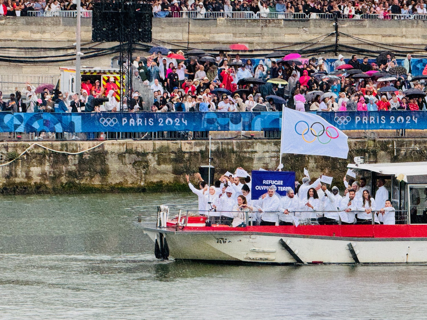 a group of people on a boat in the water