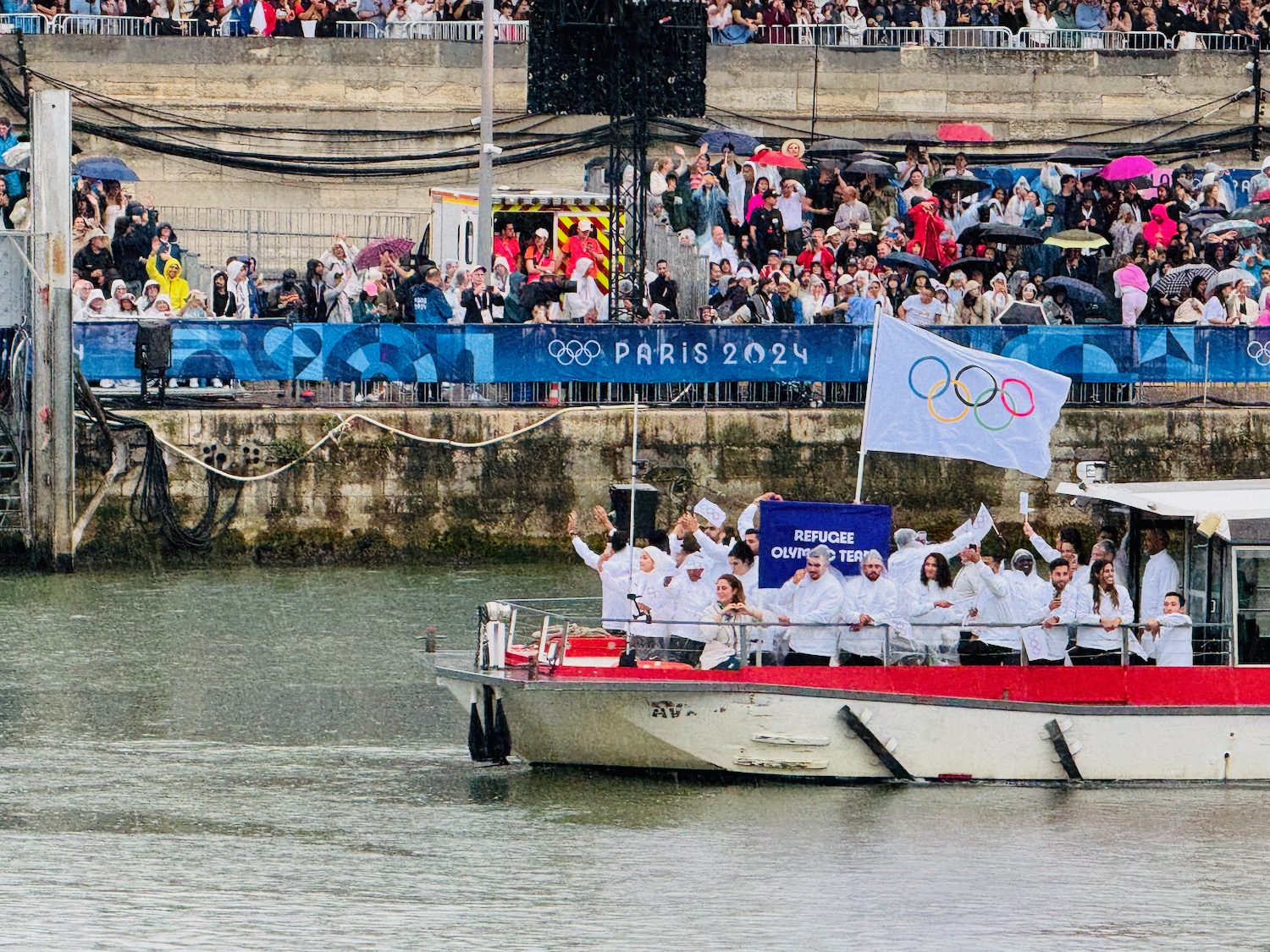 a group of people on a boat in the water