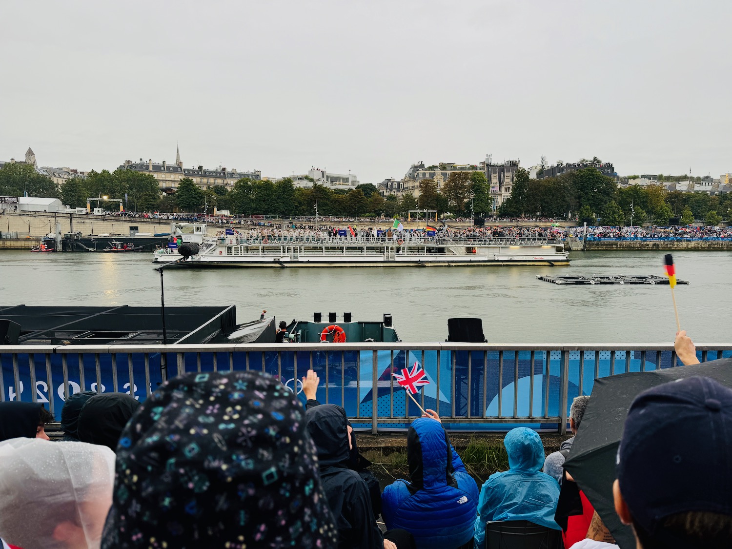 a crowd of people watching a boat race