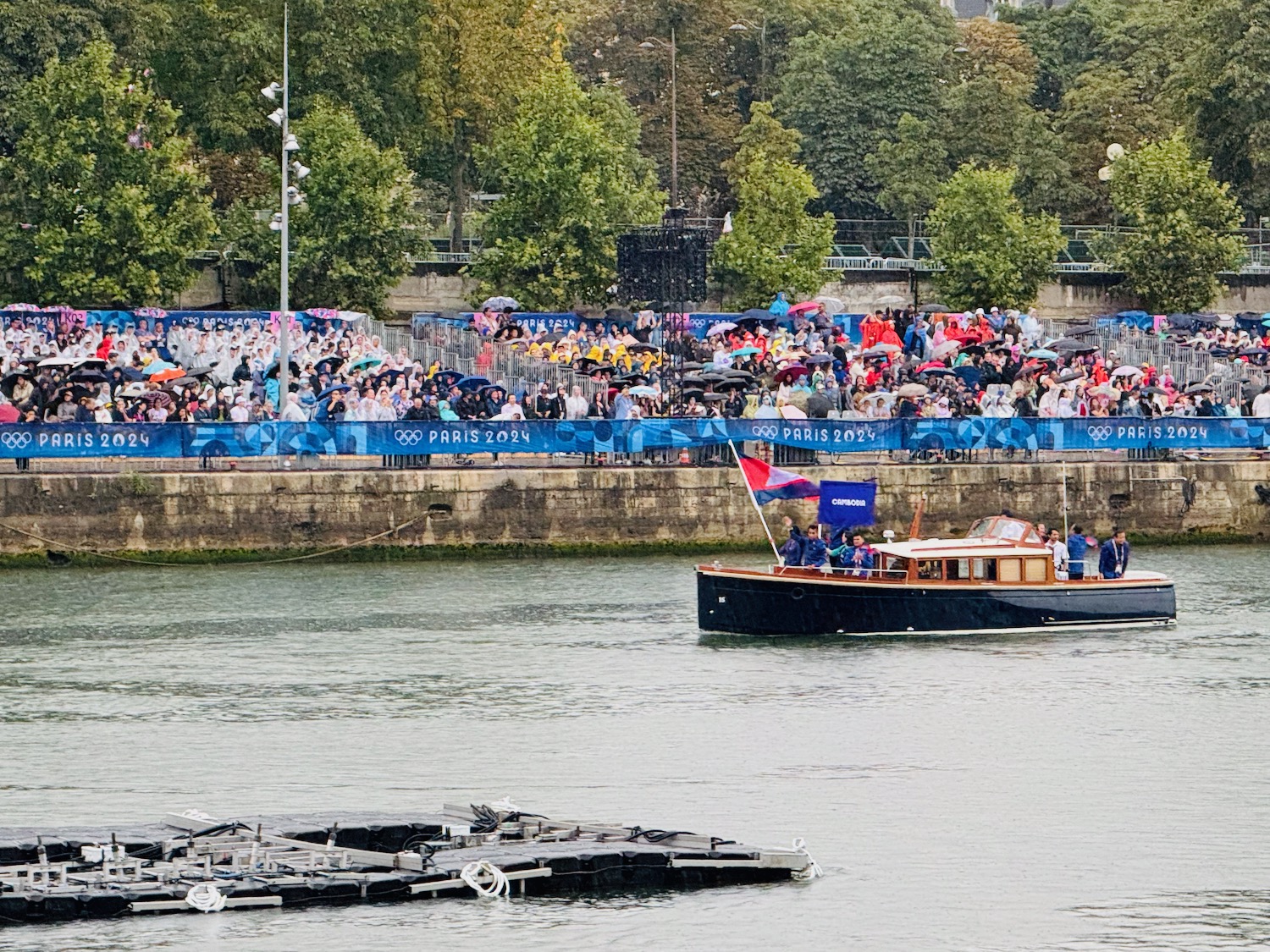 a boat on the water with a crowd watching