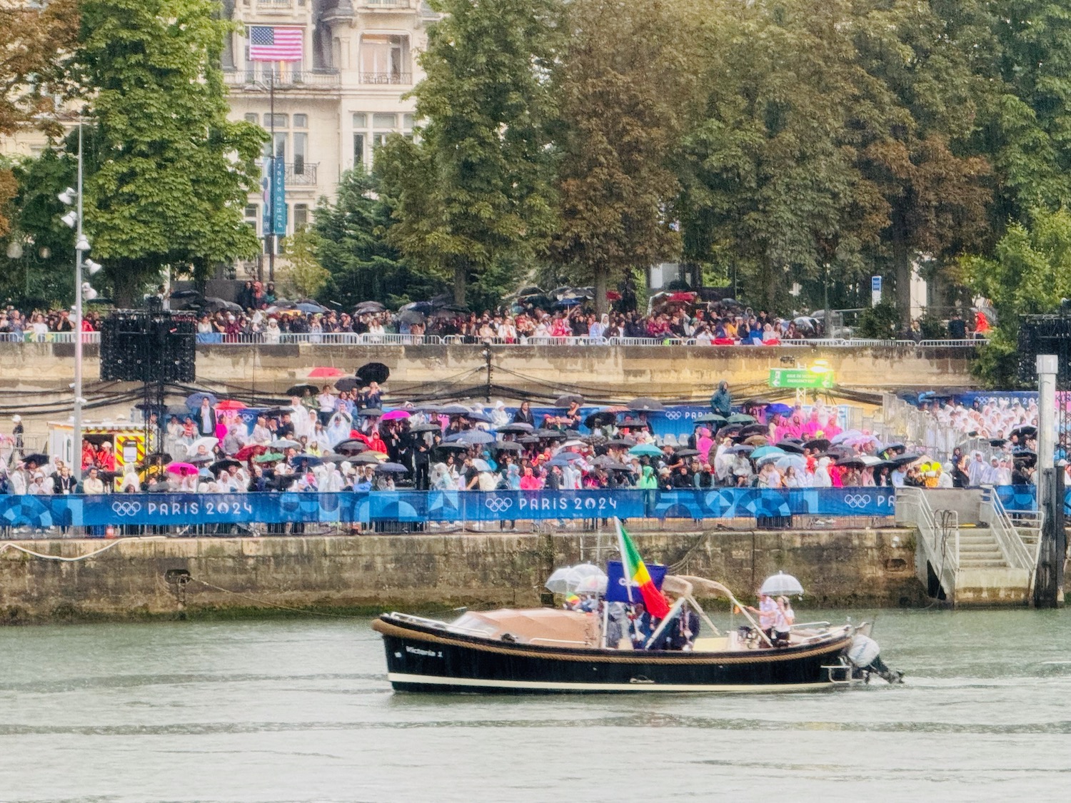 a boat on the water with people in the background