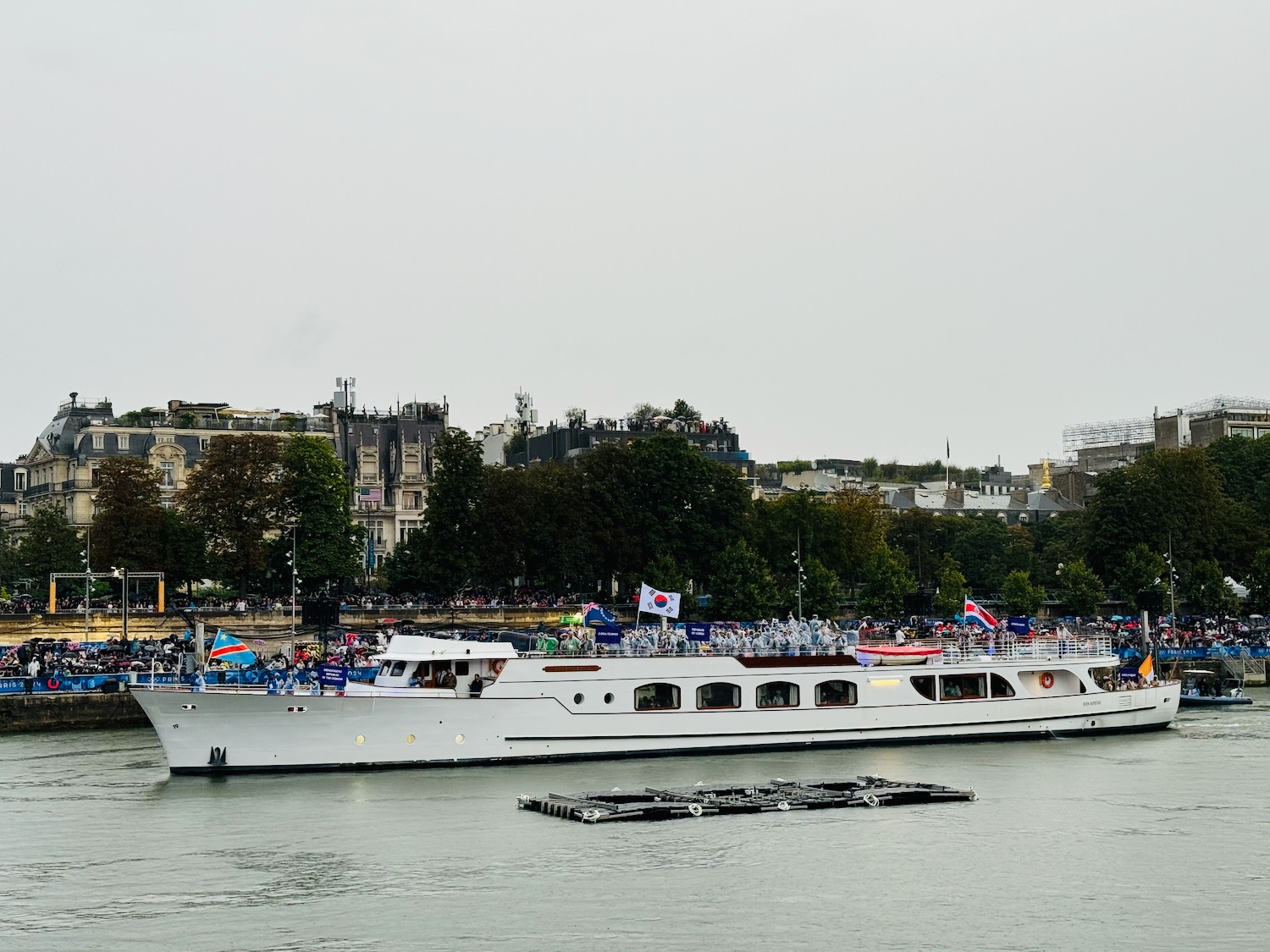 a large white boat on water with people on it