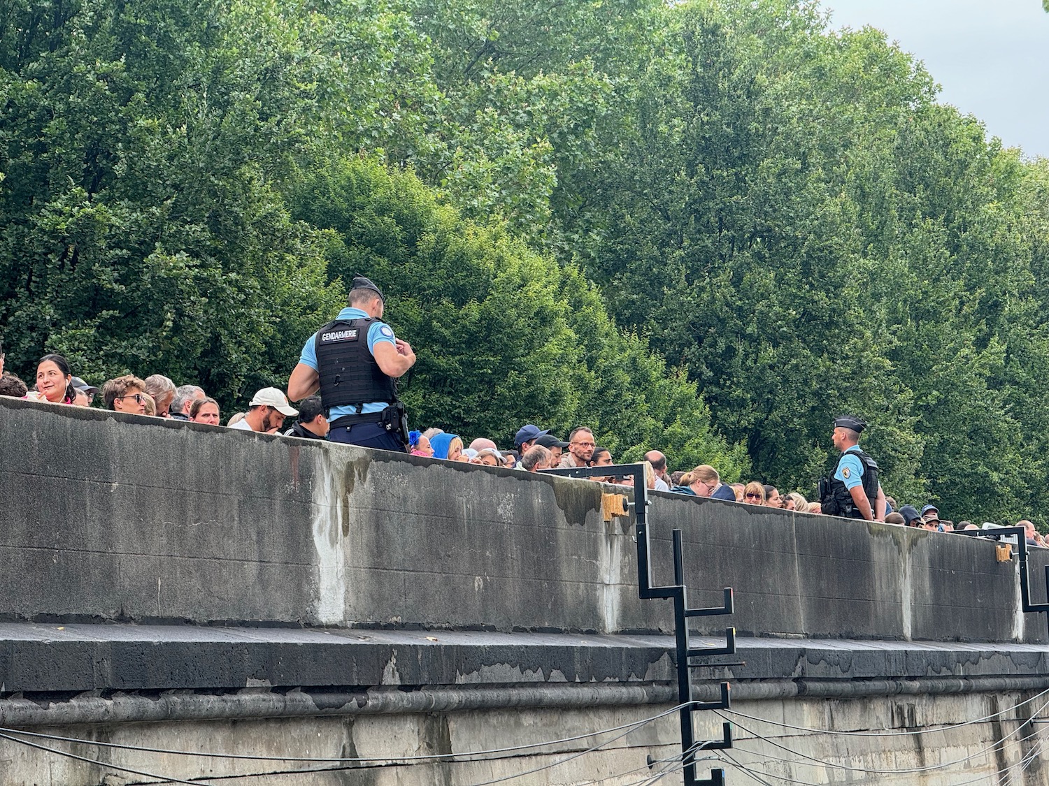 a group of people standing on a wall