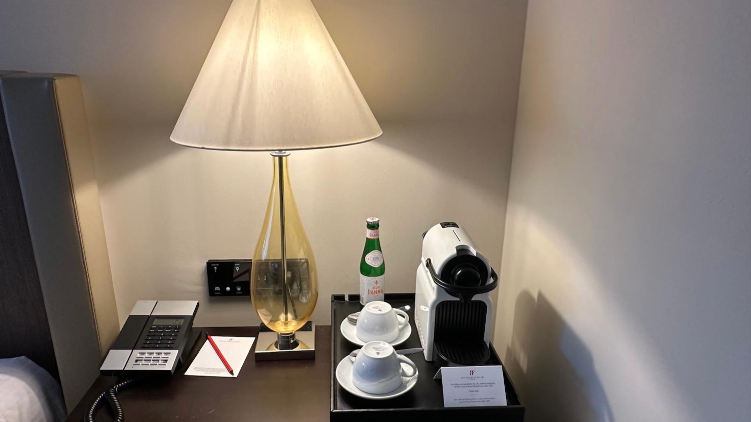 a coffee machine and a bottle on a table