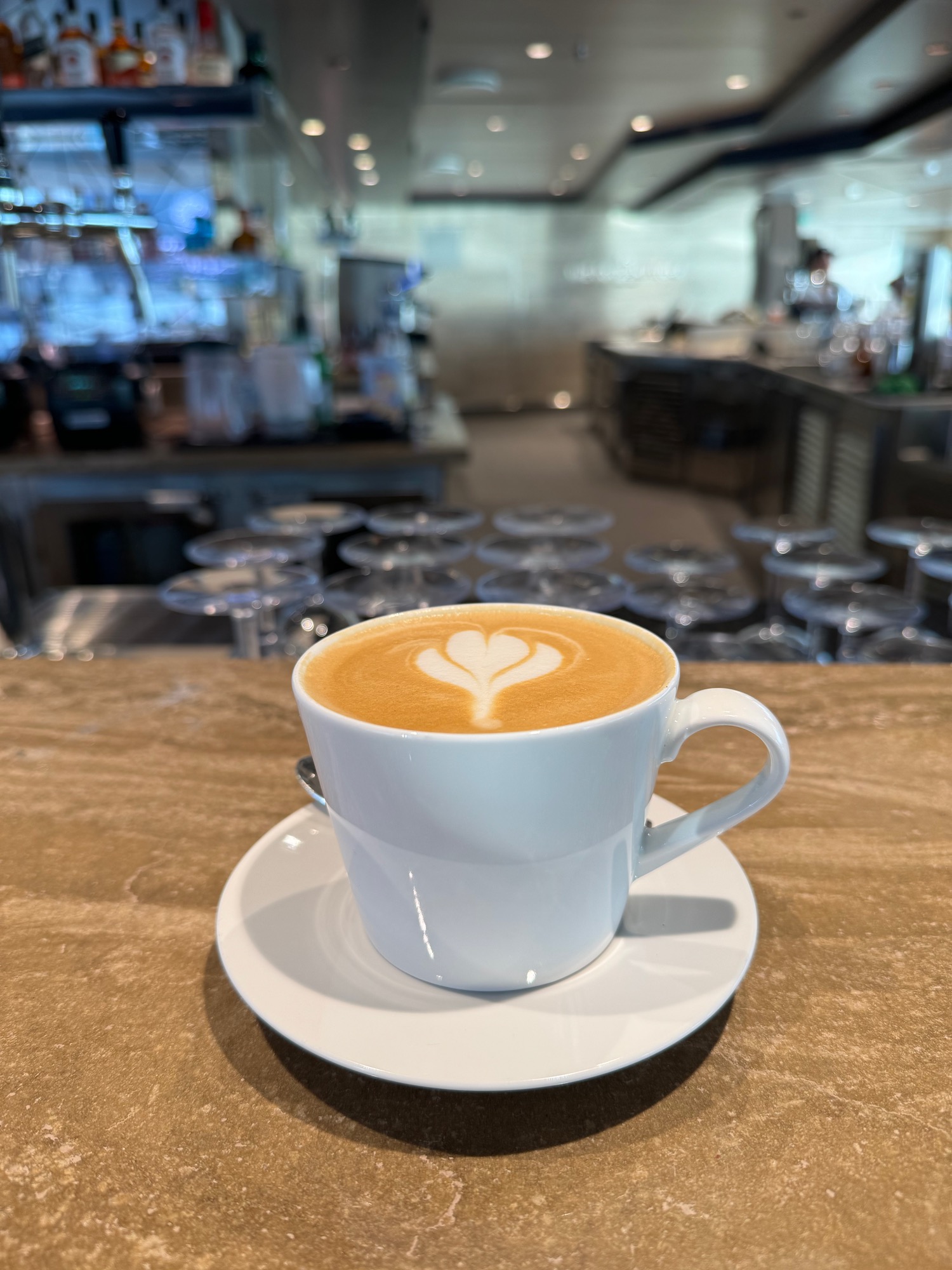 a cup of coffee with a heart design on top of it