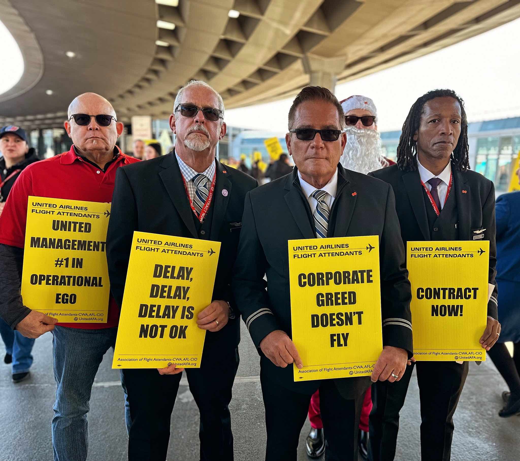 a group of men holding signs