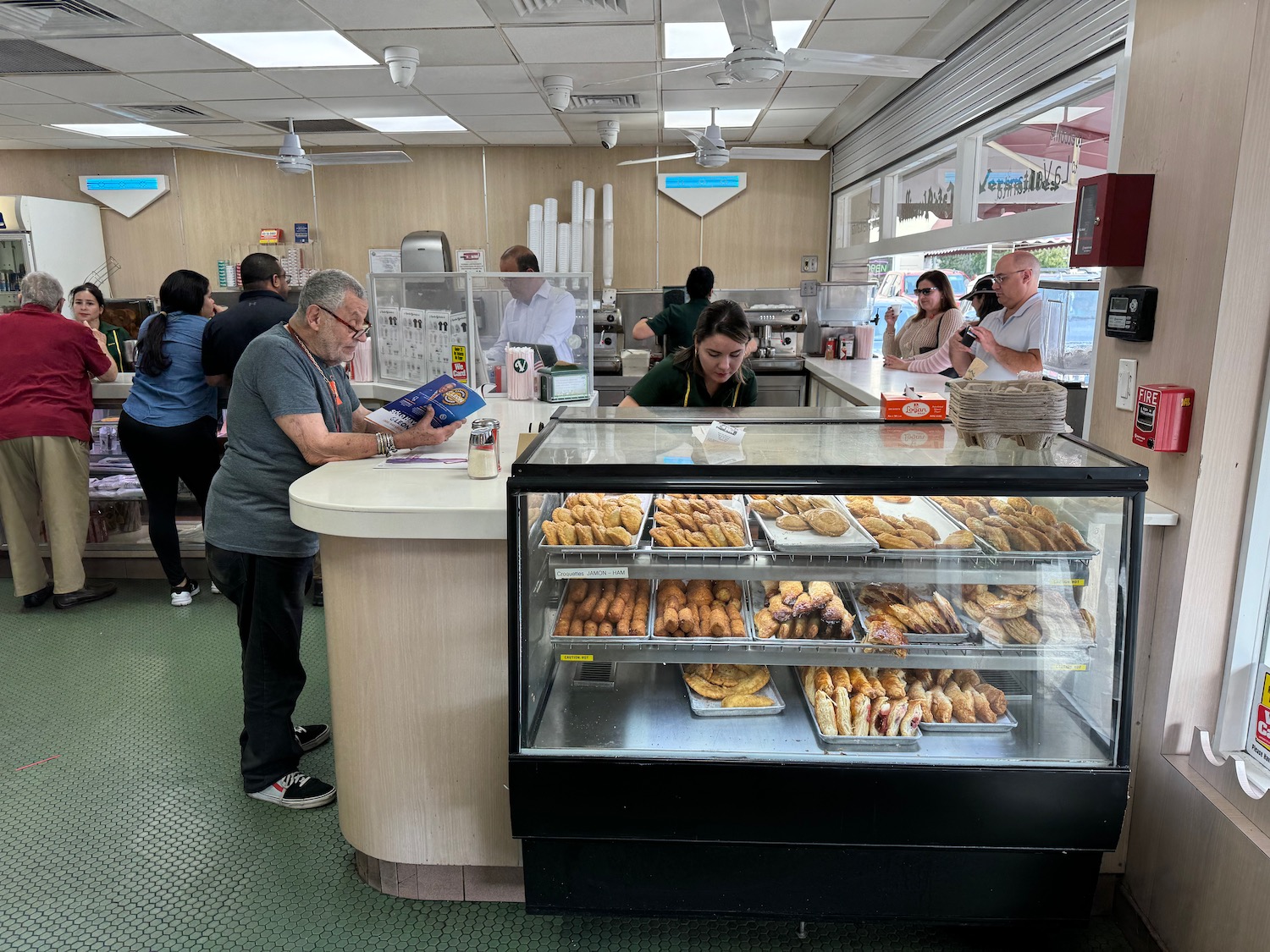 a group of people in a bakery