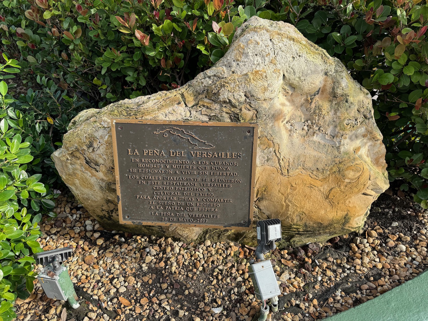 a sign on a rock