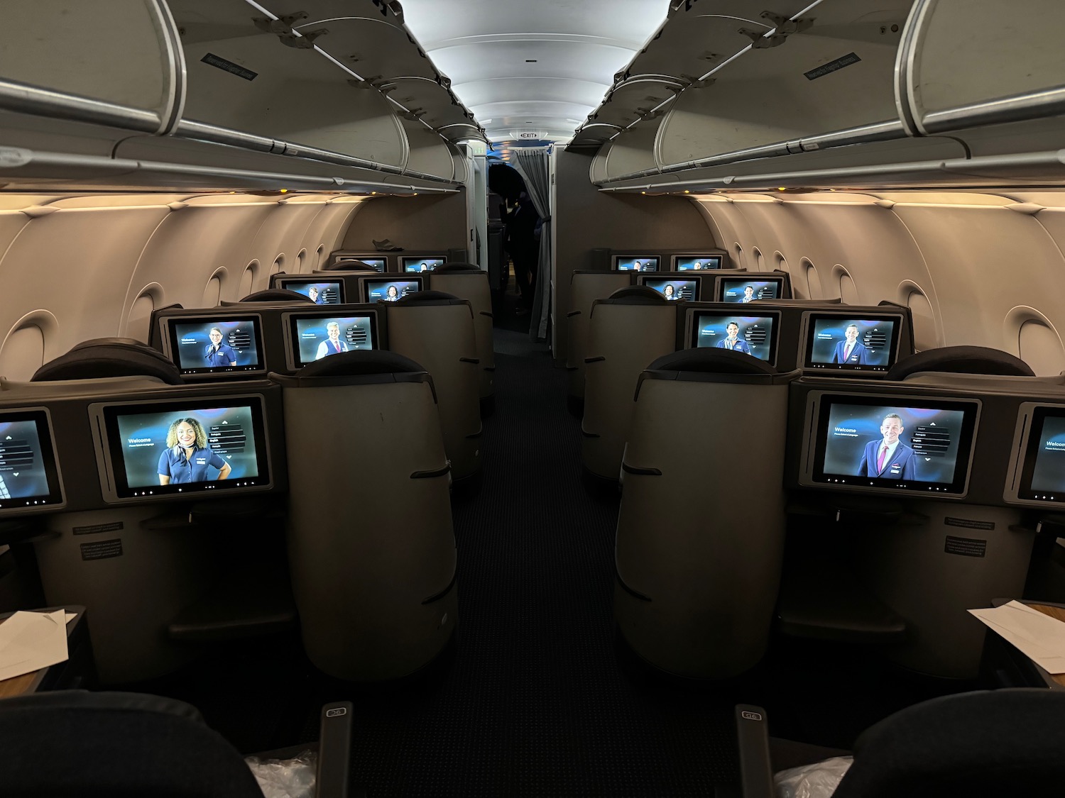 a row of seats with televisions on the back