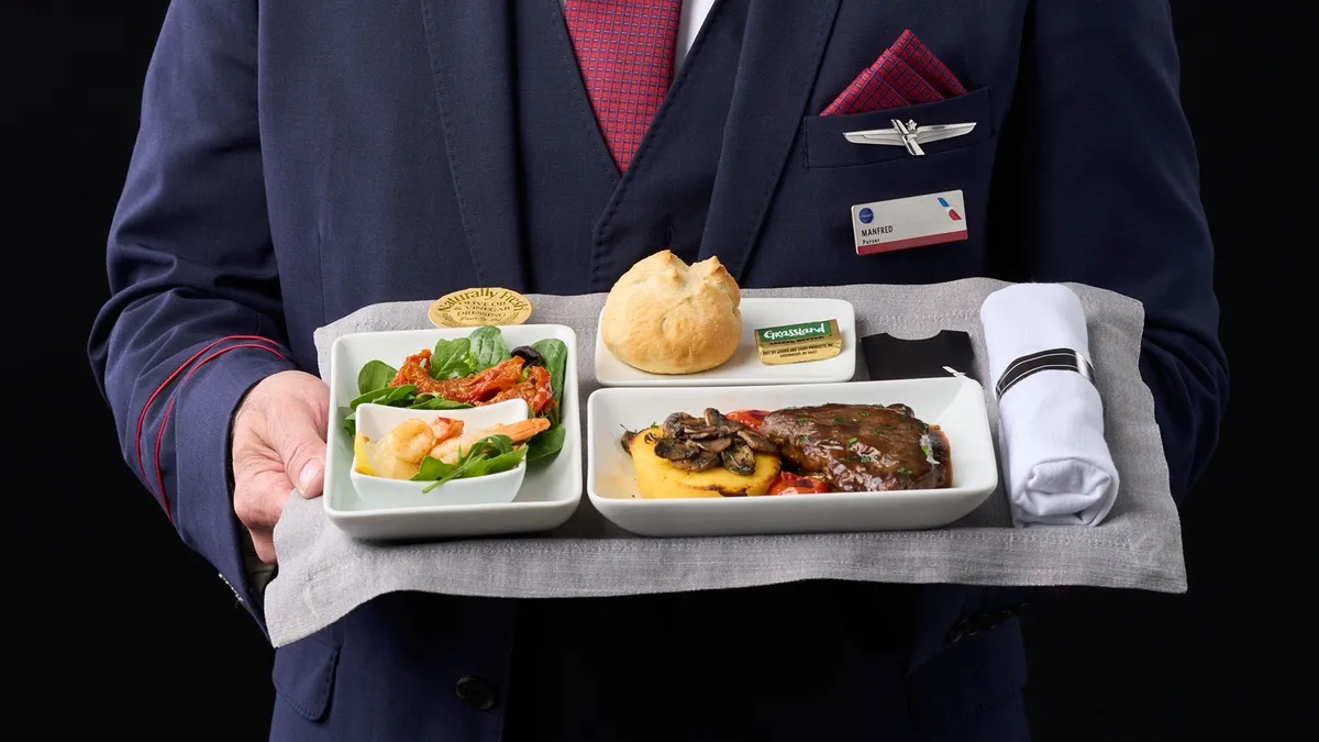 a person holding a tray of food