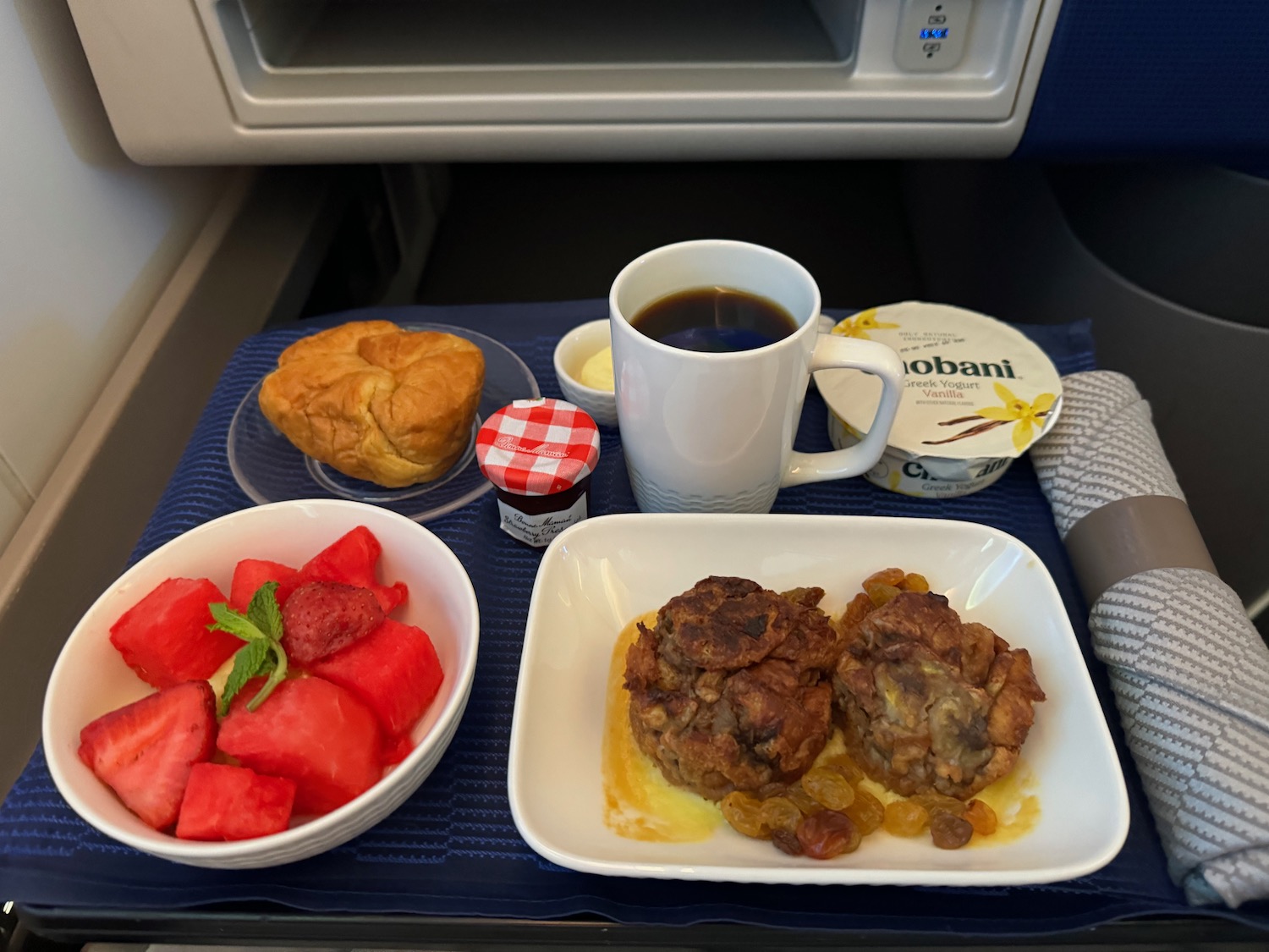 a tray of food and coffee on a tray