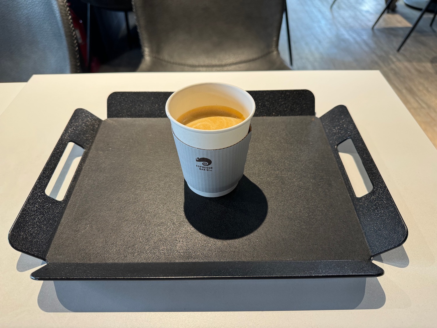 a cup of soup on a tray