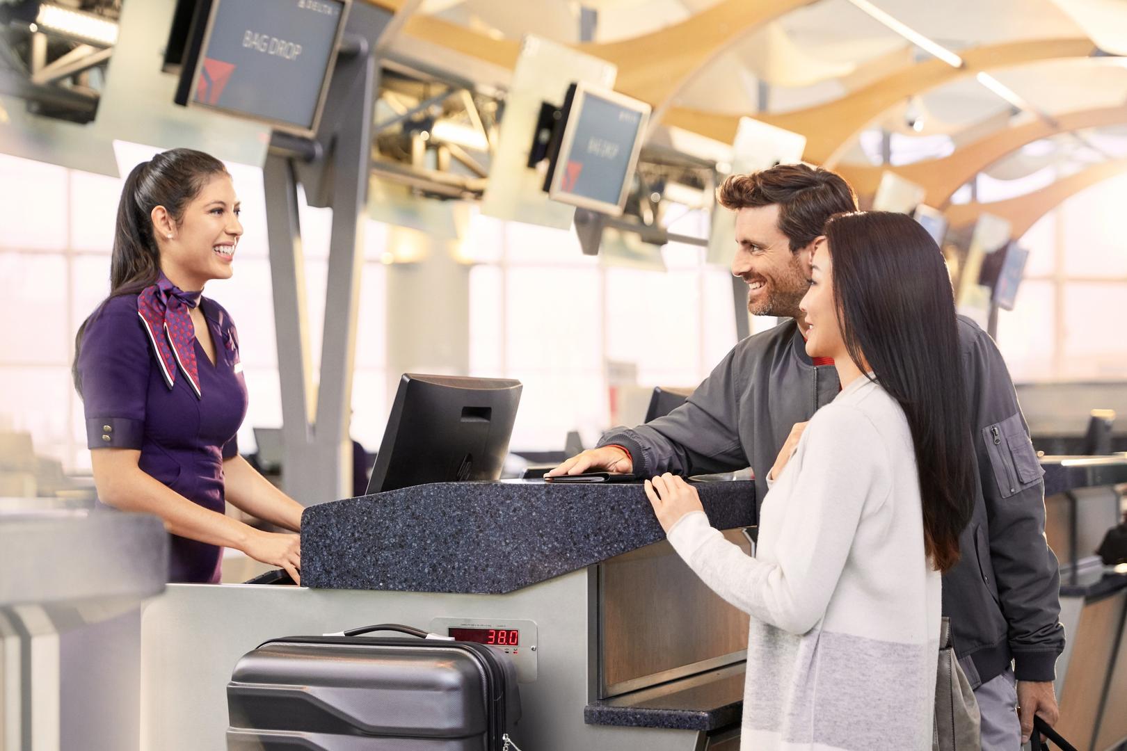 a group of people at a check-in counter