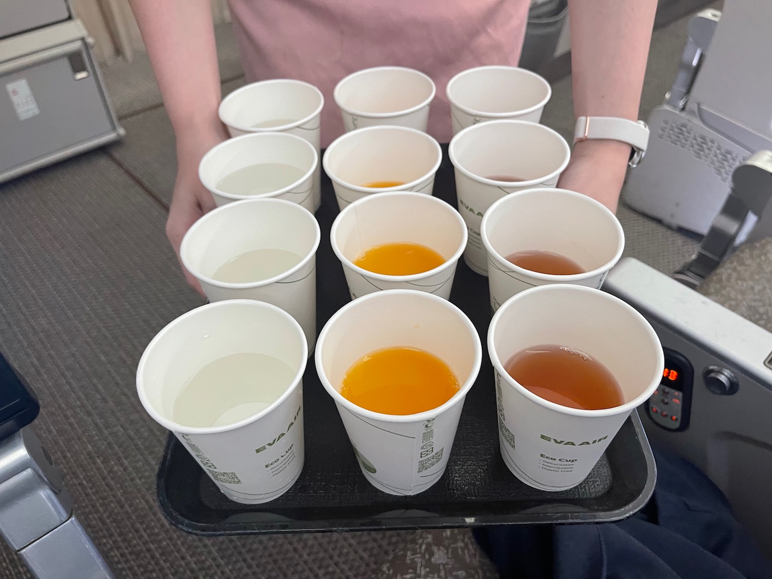 a tray with cups of various drinks