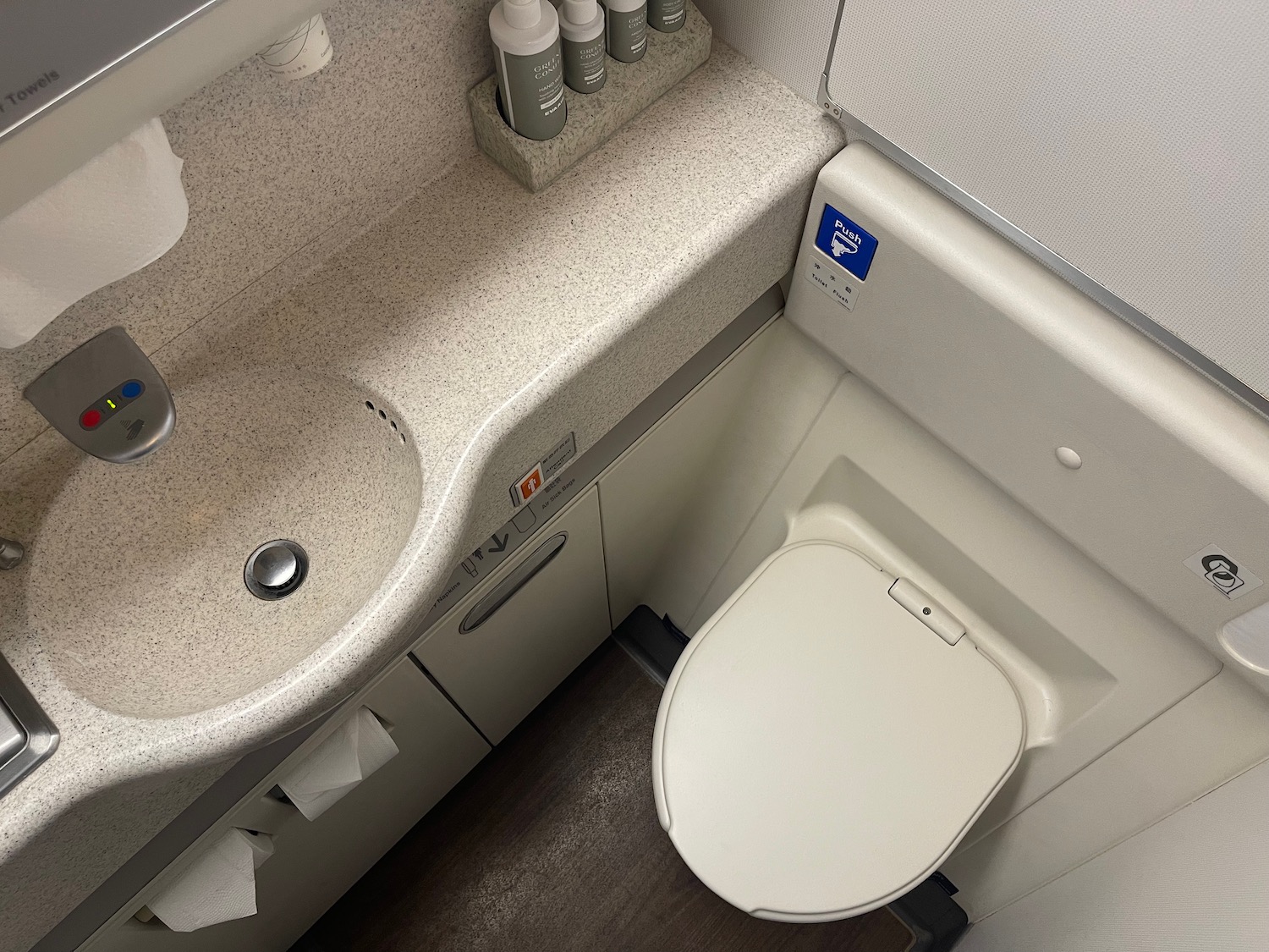 a toilet and a sink in a bathroom