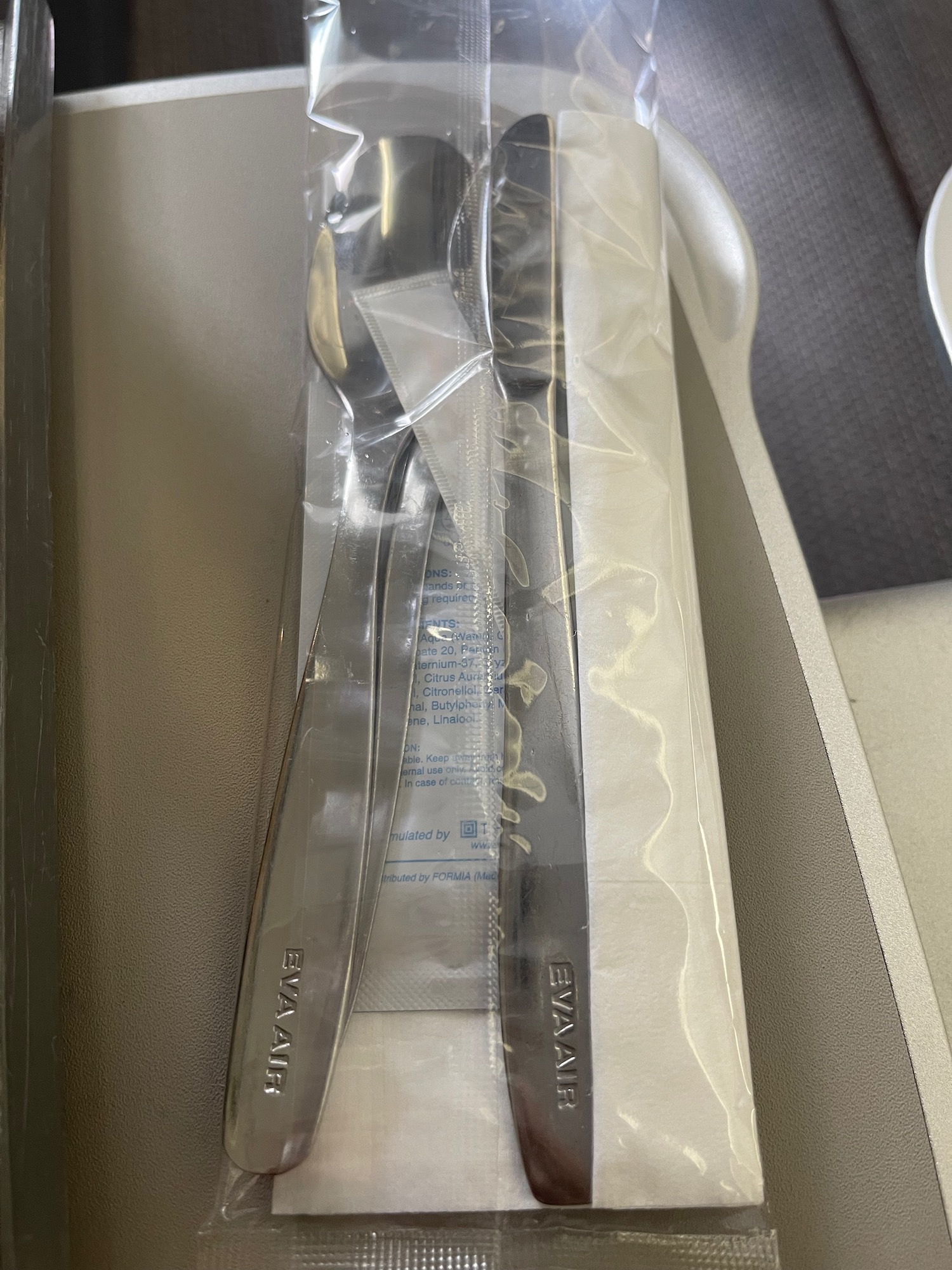 a spoon and a fork in a plastic wrap