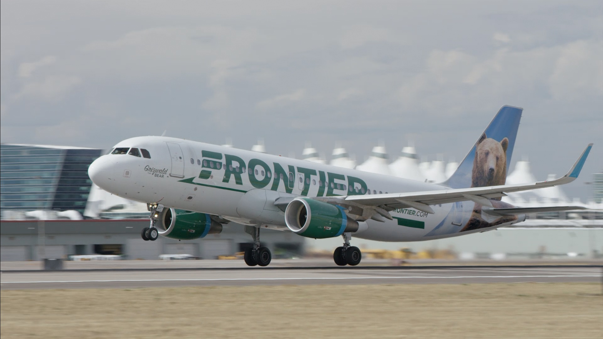 a white airplane taking off